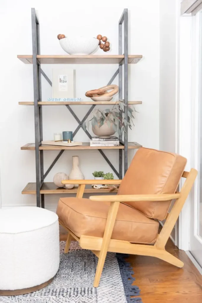 A chair and some shelves in a room.