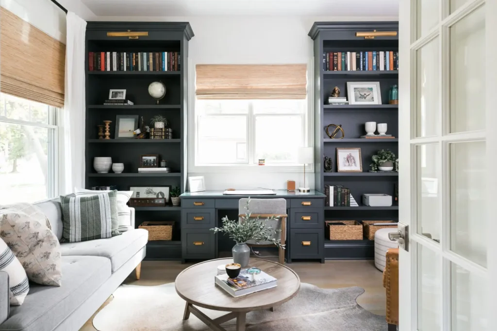 A living room with two bookcases and a couch